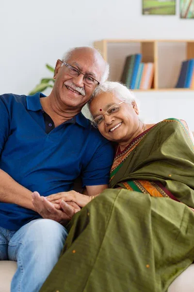Smiling senior Indian couple at home representing healthy ageing and shared wellness