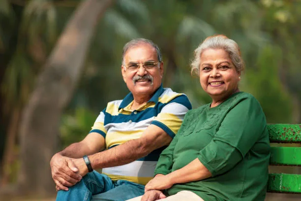 Smiling senior couple standing together, looking relaxed and confident